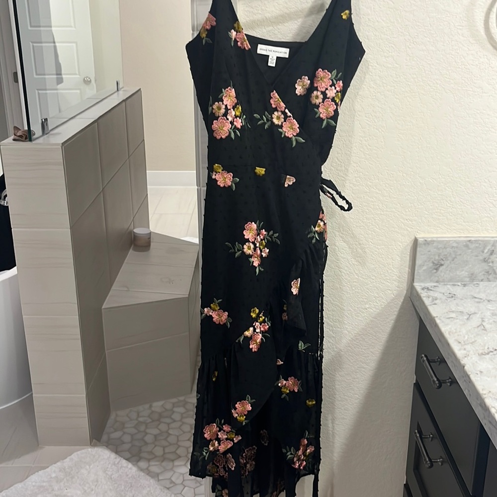 Dress the population black dress with pink flowers.